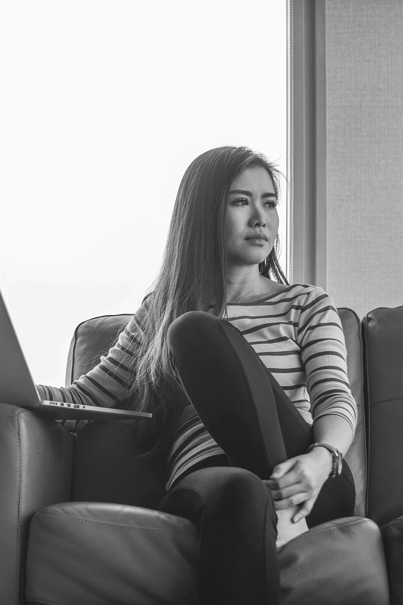 A woman sitting and staring